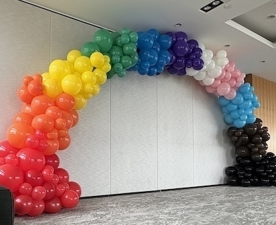 Organic 5 pole balloon arch in full 11 colours of pride